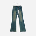 Close-up view of stylish blue jeans with a distressed finish, showcasing quality stitching and fabric texture.